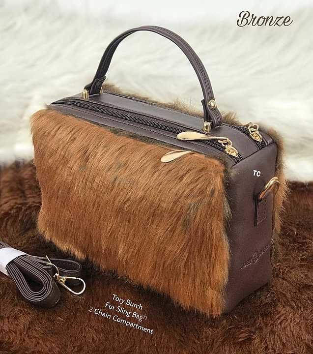 *TORY BURCH*
*Fur Sling Bag*
*With 2 Compartments*

*No Daubt in Quality*
👍👍👍

 uploaded by JMD collection on 11/21/2020