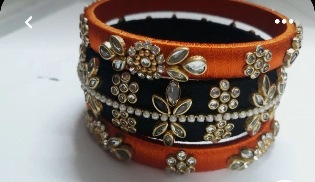 Post image silk thread bangles woman new style new lookingName: silk thread bangles woman new style new lookingBase Metal: ThreadPlating: Gold PlatedStone Type: Artificial StonesSizing: Non-AdjustableType: Bangle StyleNet Quantity (N): 1Sizes:2.4, 2.6, 2.8silk thread bangles best silk and best quality banglesCountry of Origin: India