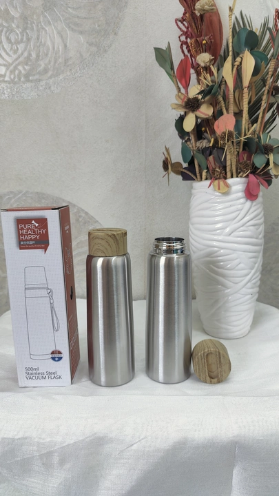 Hot & Cold vacuum bottle with wooden lid uploaded by business on 9/9/2022