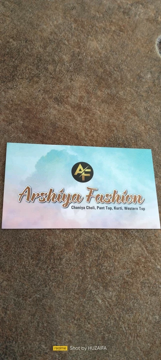 Visiting card store images of Arshiya fashion Ledis suit