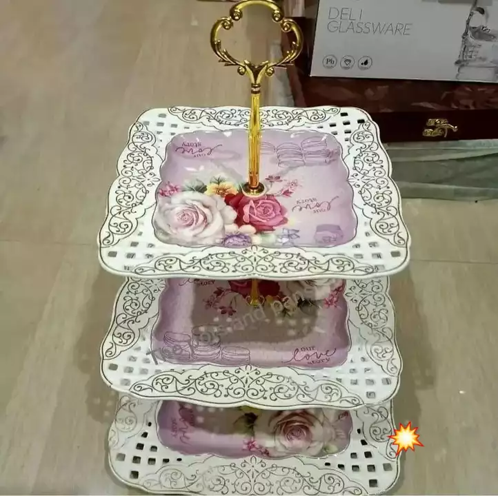 Post image 3 tiered printed dessert/snack snack server .
Material- porcelain pretty cut design Golden stand with designer Knob to hold from top
1890+120 puj