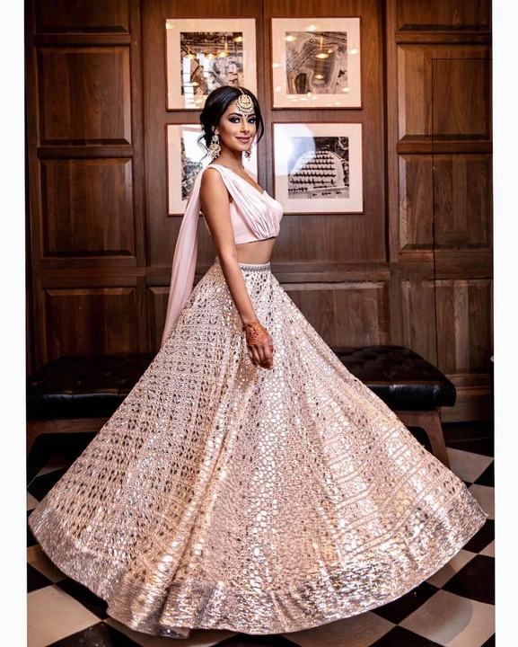 Post image *🌷Ready to wear🌷*
Bring back the show just like our pink lehenga teamed with a choli in sequins embroidery. This perfect lehenga will stun your party.
*Lehenga(Stitched)*Lehenga Fabric : GeorgetteLehenga Work : Sequins And Thread Embroidery WorkWaist : Support Up To 42Stitching : Stitched With Canvas and Can CanLehenga Closer : Drawstring and ZipLength : 41Flair : 4 MeterInner : Micro Cotton
*Blouse And Dupatta(Stitched)*Blouse Fabric : GeorgetteBlouse Work : PlainBlouse Pattern : Heart Shape Blouse Size : *Fully Stitched* Size is 38 there Extra Margin So Customer Can Adjust from 36" to 42" and *Also attached Dupatta*
*Package Contain :* Lehenga, Blouse and Dupatta, Drawstring, Batwa 
Weight : 1.500 kg
*Price : 2800/-*
#readytowear #sequinslehenga #georgettelehenga #Partyoutfits #georgetteblouse #fancyblouse #fashion #westernwear #weddingdress #lehengacholi #sequinscollection #threadembroidery #cordset
*(Note : There might be slight variation in the actual color of the product due to different screen resolution)*
