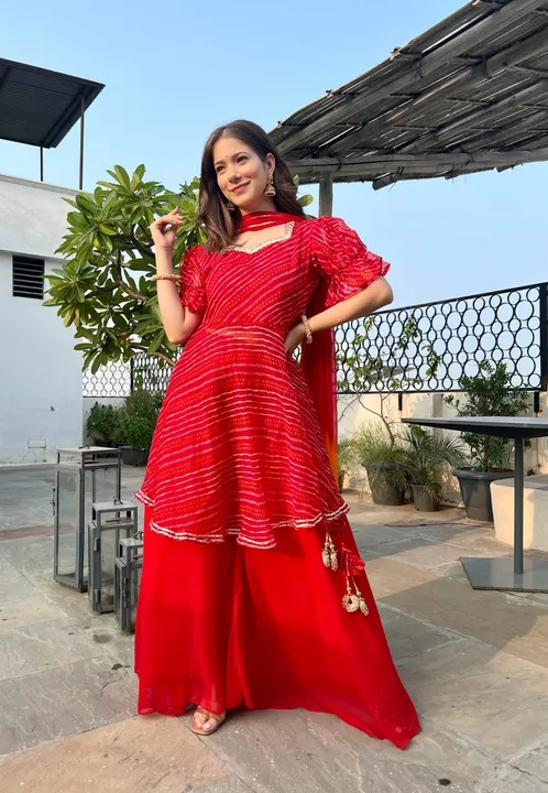 Post image I want 11-50 pieces of Palazzo set  at a total order value of 2000. I am looking for *_Effortlessly graceful !!*_💫
*_This red bandhni peplum set is a perfect addition to your wedding . Please send me price if you have this available.