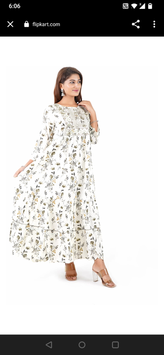 White long frock with black flower desigen  uploaded by Anamika collections on 12/16/2022