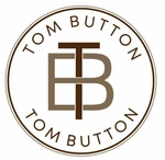 Business logo of Tom button