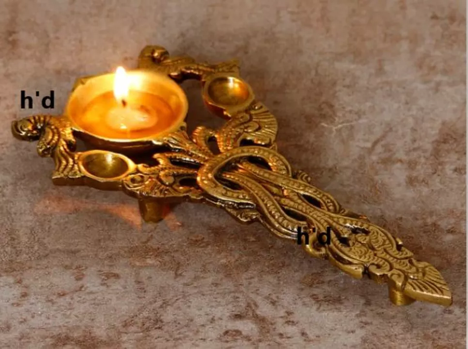 Golden Ethnic Carved Brass Diya with Handle For Pooja room and Temples  uploaded by Home decor on 5/30/2024
