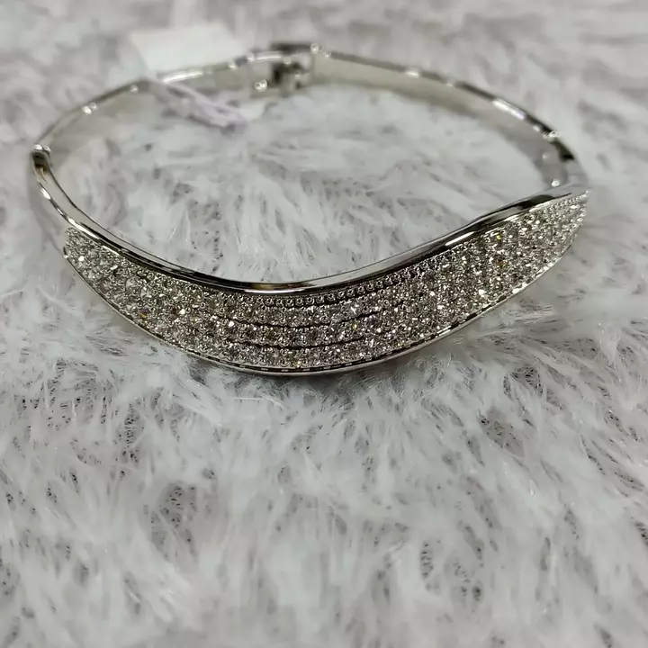 Silver and gold bracelet kada uploaded by business on 1/16/2023