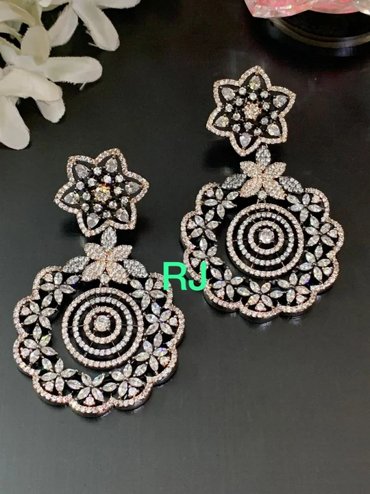 Product image with price: Rs. 1199, ID: dual-tone-plated-diamond-earrings-3731cf32