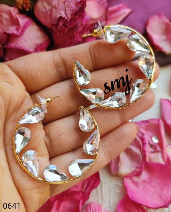Ab
Swweet trendy colored crystal stone hoops in round, drop and long drop shapes Rs. 270/+⛵☀️ smj064 uploaded by Seemi fashion on 2/14/2021