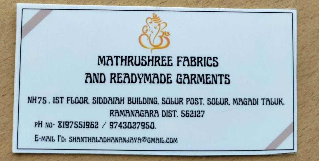 Visiting card store images of Mathrushree fabrics and readymade garments
