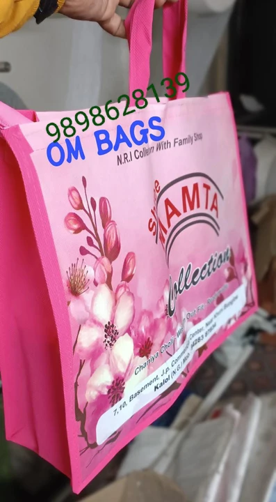 Visiting card store images of Om BAGS non woven
