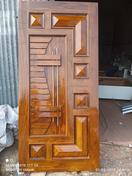 Teak wood door uploaded by business on 2/22/2023