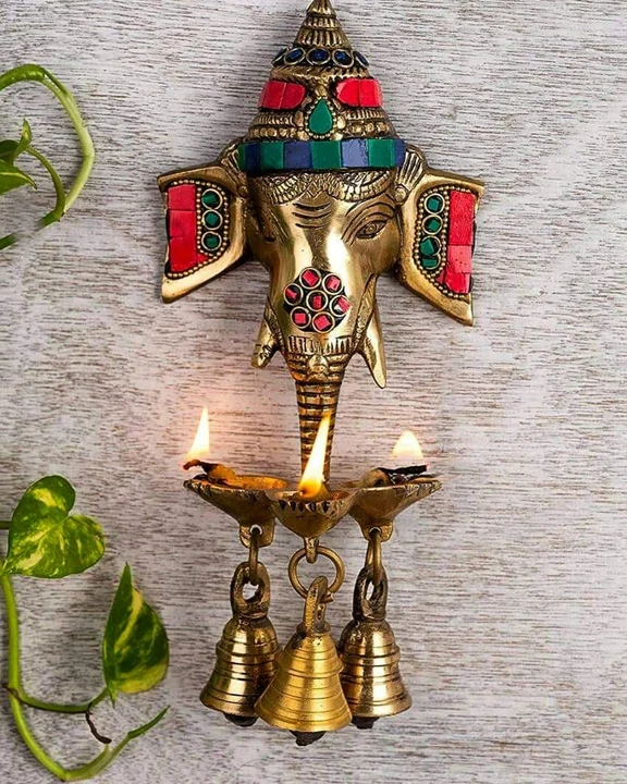 Brass stone work hanging ganesha uploaded by business on 3/5/2023