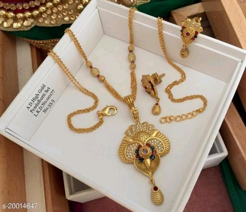 Post image Brass Designer Gold Plated Pendant With Chain And Earrings
Name: Brass Designer Gold Plated Pendant With Chain And Earrings
Base Metal: Brass &amp; Copper
Plating: Gold Plated
Stone Type: Cubic Zirconia/American Diamond
Type: Pendant with Chain
Net Quantity (N): 1
Sizes:Free Size
Country of Origin: India