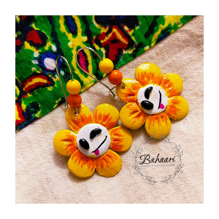 Sunflower clay earring uploaded by business on 2/25/2021