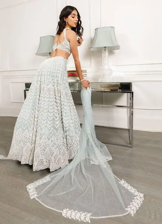 White Colored Bridal Net With Silk Material Lehenga Choli With Embroidery Work uploaded by Ashokawholesellarfashionstore on 3/20/2023