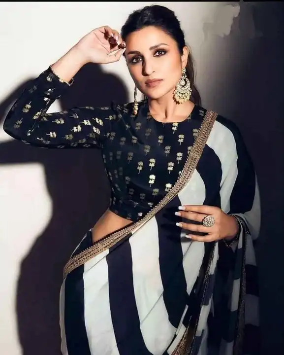 faux Georgette
 black & white color combinations  print inspired from Bollywood uploaded by Manasvi Enterprise on 4/3/2023