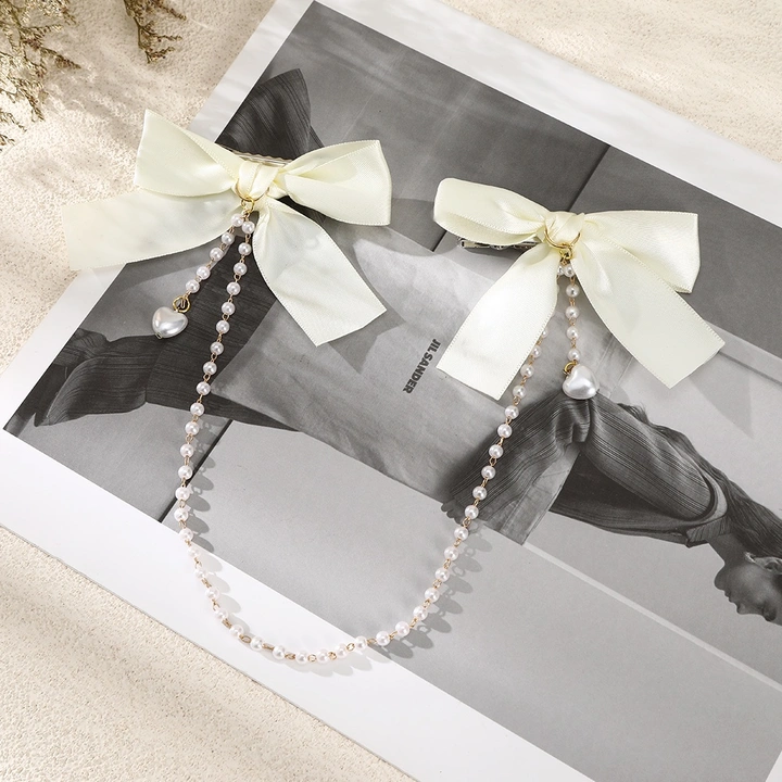 Cute bow pairs chain korean pearl clips... uploaded by The_royal bow on 4/20/2023