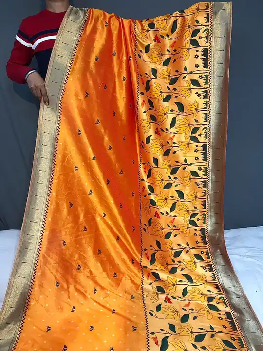 Post image FRESH ARRIVAL❤️

*Catalog: Titli*

Pure banarasi paithani silk saree with resham weaved zari and 12 inch border with meenakari flower designs and contrast border both sides with rich pallu