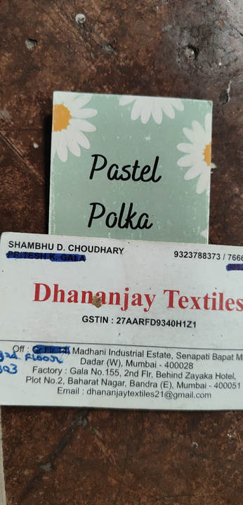 Visiting card store images of Dhananjay textiles