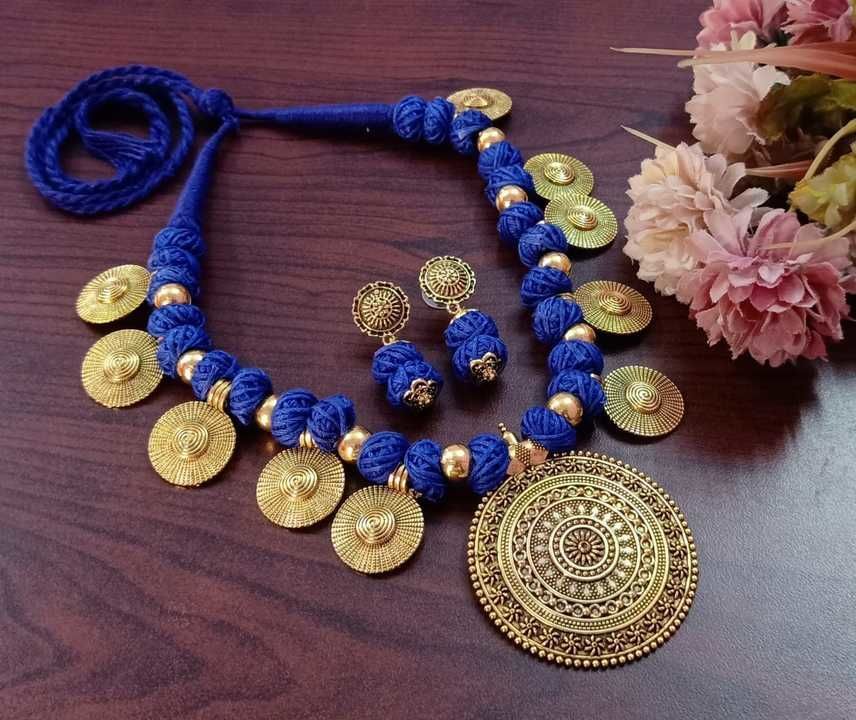 German Silver Round pendant with coin thread dori ball necklace set uploaded by Sandhya fashion jewellery on 3/11/2021