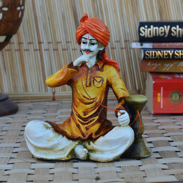 Polyresin Rajasthani Man Using Hookah Handcrafted Decorative Showpiece  uploaded by Home decor on 5/27/2023