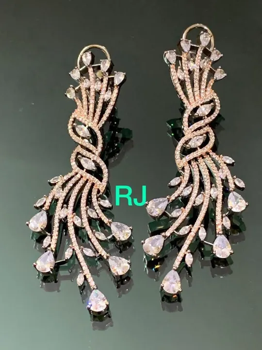 Dual tone plated diamond replica earrings uploaded by SK Fashion on 5/28/2023
