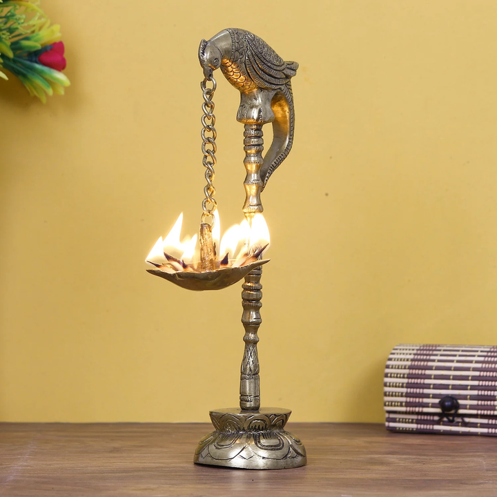 🪔SKU = BGGDB115
Golden Decorative Handcrafted Parrot Showpiece Brass Diya Stand with 7 wicks
 uploaded by Home decor on 6/1/2023