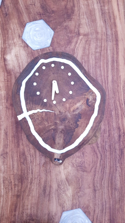Solid wooden and epoxy wall clock. uploaded by business on 6/9/2023