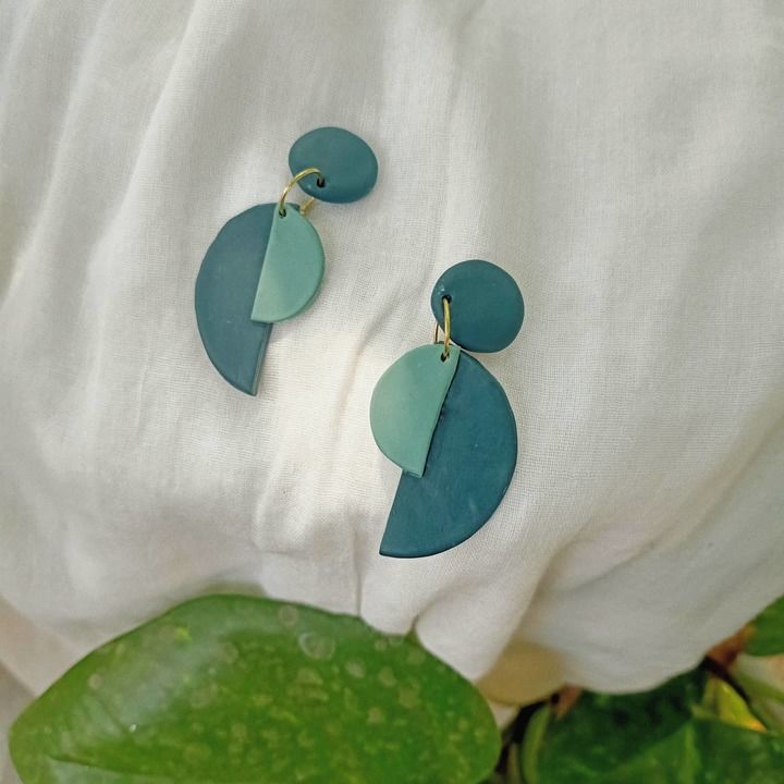 The semircuclar statement earrings uploaded by business on 3/13/2021