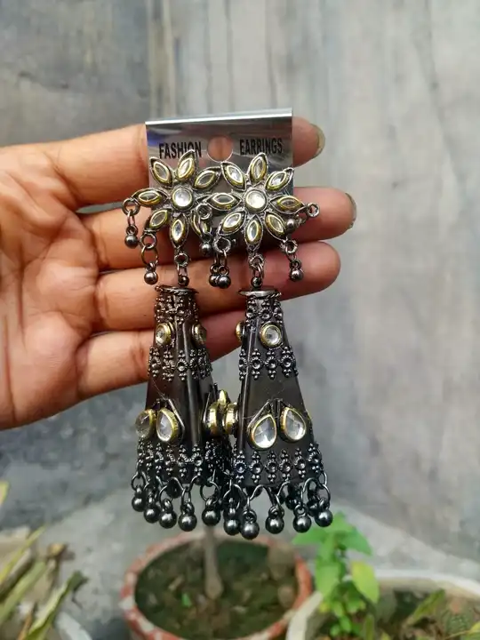Black platted dual tone earrings  uploaded by business on 6/27/2023