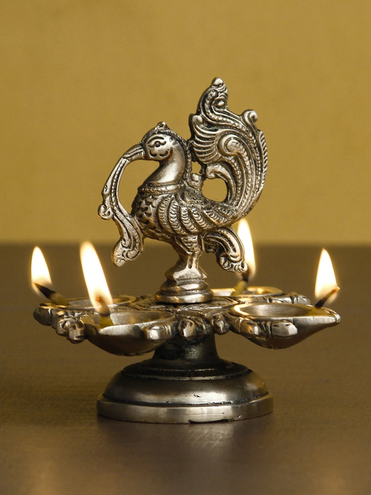 🪔🪔Golden Brass Decorative Handcrafted Peacock Showpiece with Diya for 4 Wicks
 uploaded by Home decor on 6/29/2023