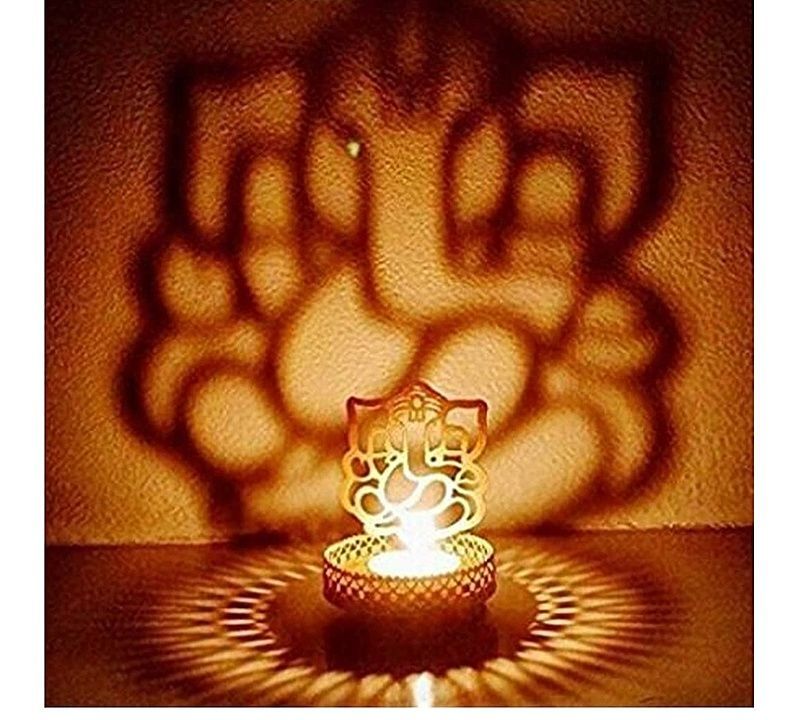 NISHITA CREATION Metal Divine Shadow Ganesh Tealight Candle Holder (1)

 uploaded by business on 7/15/2020
