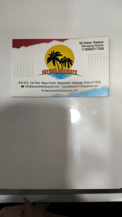 Visiting card store images of Joyous global holidays pvt Ltd