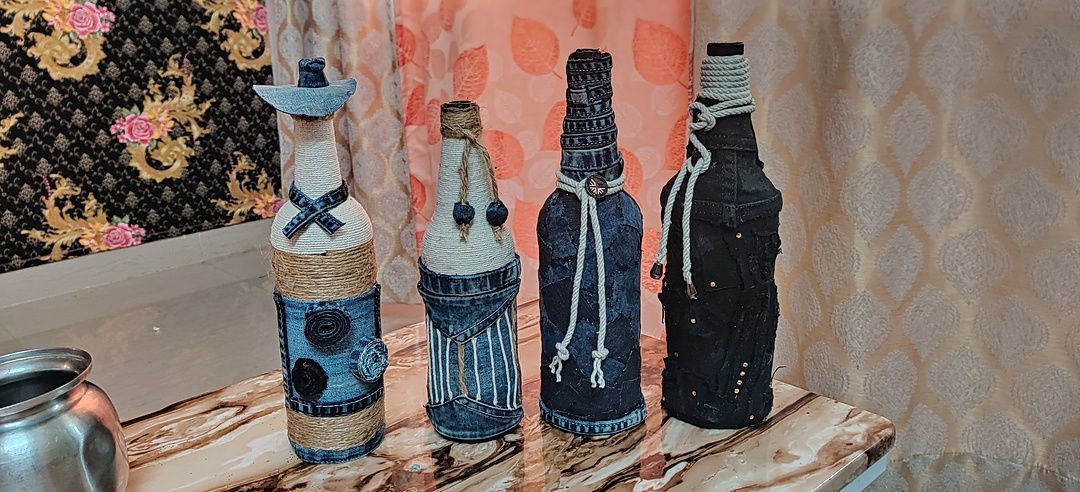 Flawless handicraft
Glass bottle art
Beautiful jute  with DENIM work on waste liquor bottle. uploaded by business on 7/16/2020