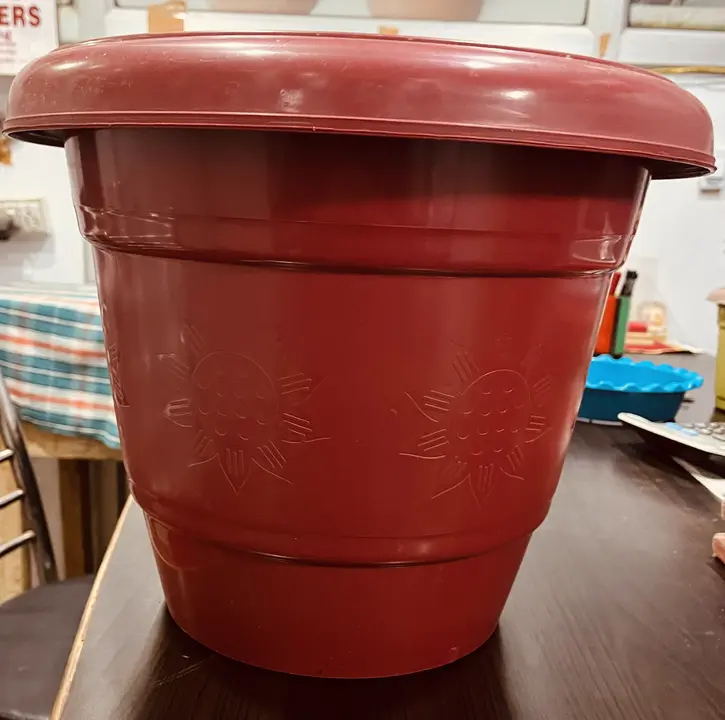 Plastic flower pot 14” red uploaded by business on 8/8/2023