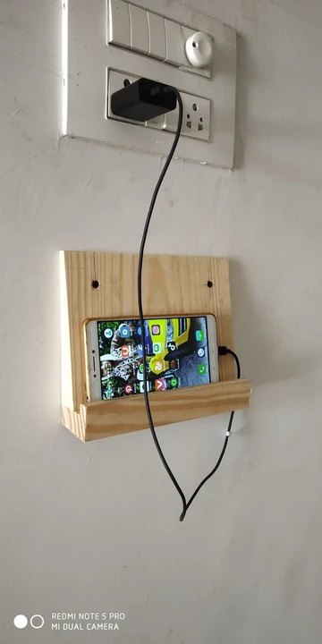Wall mobile holder uploaded by Gauri creations on 8/12/2023