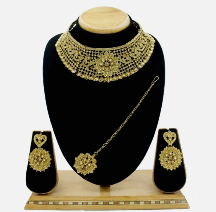 Gold plated jewellery set with maang tika uploaded by Barbarika trading co. on 8/16/2023