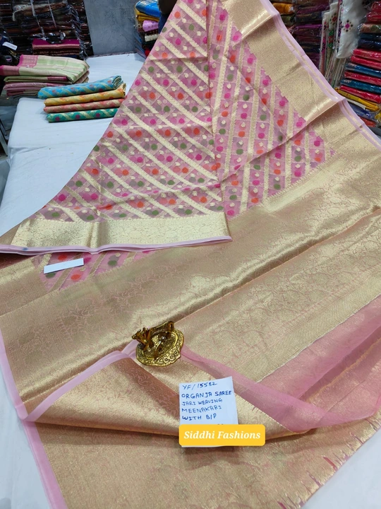 Post image Organza jari weaving Saree with Meenakari work.  Both side jari border and jari pallu with blouse