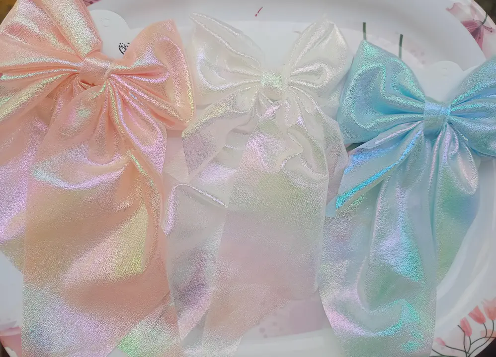 Holographic bow clips ✨ uploaded by business on 10/4/2023