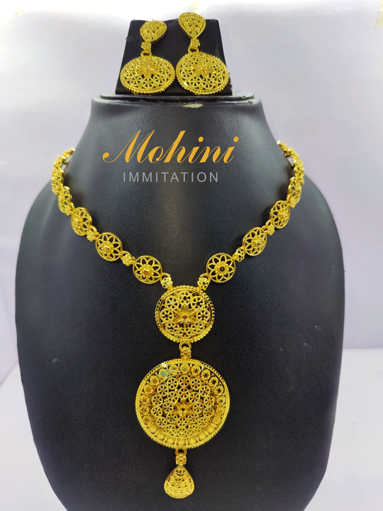 Post image mohini immitation Gold plated necklace set for women is made of alloy. Women love jewellery; specially traditional jewellery adore a women. They wear it on different occasion. They have special importance on ring ceremony, wedding and festive time. They can also wear it on regular basics. Make your moment memorable with this range. This jewel set features a unique one of a kind traditional embellish with antic finish.