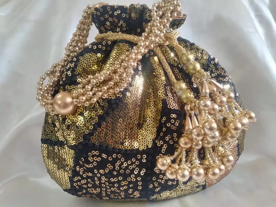 Post image I want 12 pieces of Designer potli bags n clutches manufacturers at a total order value of 1000. Please send me price if you have this available.