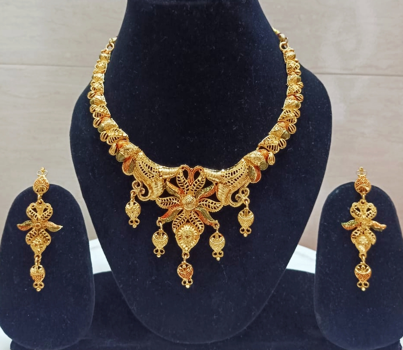 Golden necklace set uploaded by business on 10/8/2023