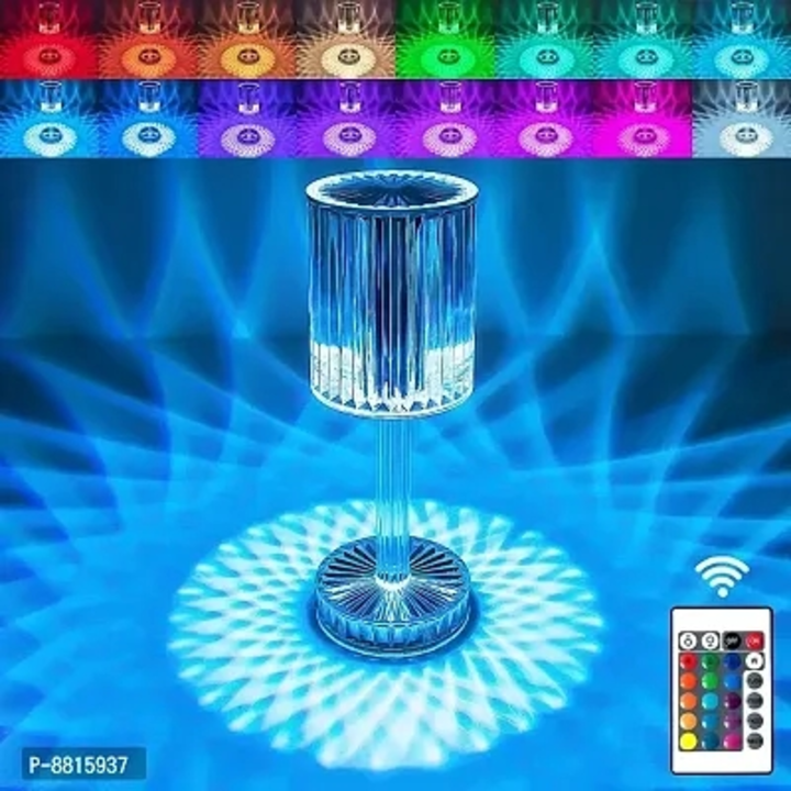 Post image KREVIA Decorative Crystal Desk Lamp Touch Touching Control LED Projector Shadow Remote Acrylic Table Desk Atmosphere Night Rose Light | RGB 16 Colors Changing USB Rechargeable lamp Multi Use (1-Pcs)
Price - 901
Within 6-8 business days However, to find out an actual date of delivery, please enter your pin code.
Material: High-quality Pama acrylic material + non-flashing lamp beads | Size: 8.5 x 25 cm | Version：16-color Version(Remote control version) | Lighting solutions service: Lighting and circuitry design | Control Mode: Touch Control, Remote Control | Weight: 700Gram Design: Crystal ball table Lamp | Color Temperature(CCT): 3 colors or RGB 16 colors | Input Voltage(V): DC 5V | Power Supply: Battery, USB or Plug in | Light Color: 3 Colors/Changeable/RGB. Three Kind of Light color temperature, touch switch design, intimate and convenient, the light is delicate, comfortable and natural. Premium grade acrylic crystal that illuminates beautiful reflections with built-in LED chips. | Can be controlled even with a distance through paired remote controller or by just touching the surface of the lamp. The crystal table lamp will create a romantic and switch the color you want on any occasion, sparkling and colourful, its a surprise gift for your partner, friends, families.
 Free delivery 
 Returns: Within 7 days of delivery. No questions asked
 NEW Avail cashback on all your orders in Wallet
 Use 5% flat off on all prepaid orders