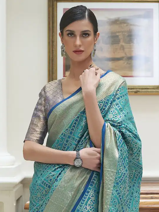 Post image This soft Patola Saree is smooth with engraved designs to enhance the overall appeal of the saree. Rich incredible details with beautiful colour, this is a beauty to behold.

•Saree length : 5.5 meters
•Blouse piece :  Brocade 0.8 meter
•Fabric : Silk