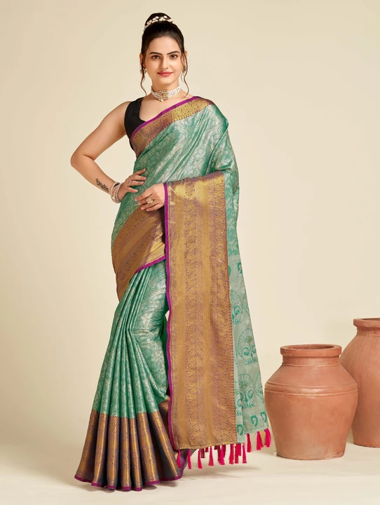 Green color tissue silk saree with woven design uploaded by business on 12/16/2023