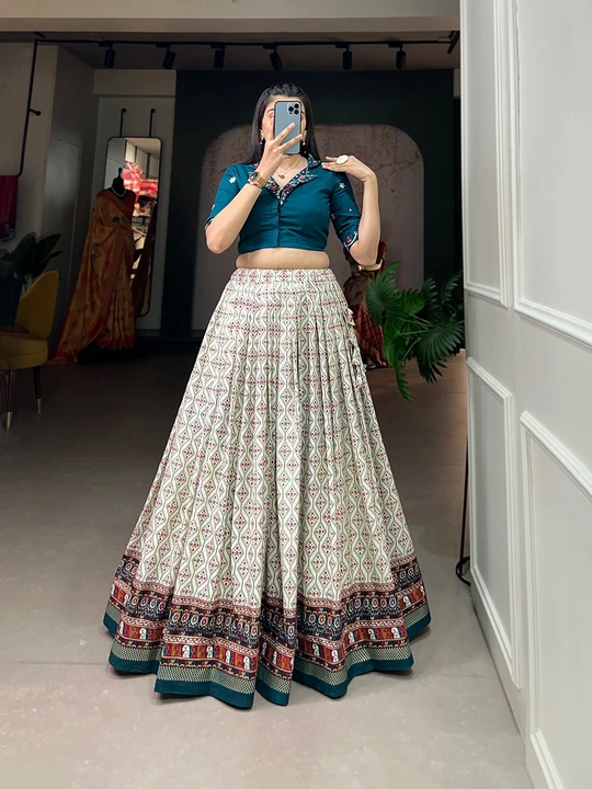 Post image *🌷Co-ord set🌷*

Add a delicate drama to your wrodrobe, the cotton lehenga co-ord set, where elegance meets comfort🍁.


*Lehenga(Stitched)*
Lehenga Fabric : Rayon Cotton
Lehenga Work : Patola With Foil Print
Waist : Supported up to 42
Stitching : Stitched With Canvas 
Lehenga closer : Drawstring with tassels
Length : 41
Flair : 3.60 Meter
Inner : Micro Cotton 

*Blouse (Stitched)*
Blouse Fabric : Pure Cotton
Blouse Work : Plain And Handwork With Mirror Work 
Blouse Size : 38” There Is Margin Customer Can Adjust Upto 44
Blouse Length : 15
Sleeve Length : 12

*Package Contain : Lehenga, Blouse*

Weight : 0.950 kg

#printedlehenga #cottoncroptop #cottonlehengacholi #bridesmaidlehenga #inidiantreditionalwear #partywear #mirrorwork #handworkworklehenga #foilprint #fancytop #co-ordset #twopiececollection
