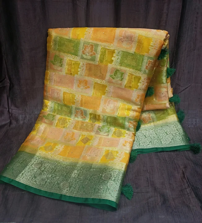 Post image Fancy Organza Silk latest collections products with high quality fabrics and latest designing. Proper stone work is done in the saree giving richness of organja.