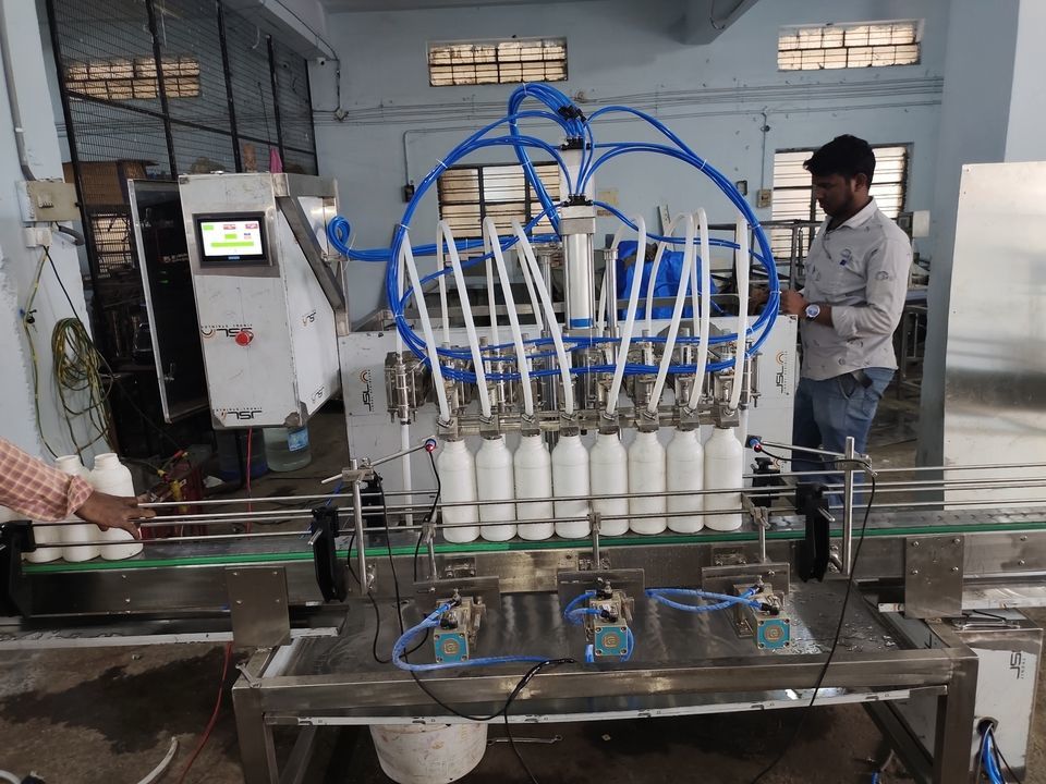 8 Head automatic bottle filling machines uploaded by Sri pack packing machinery pvt ltd on 3/25/2021