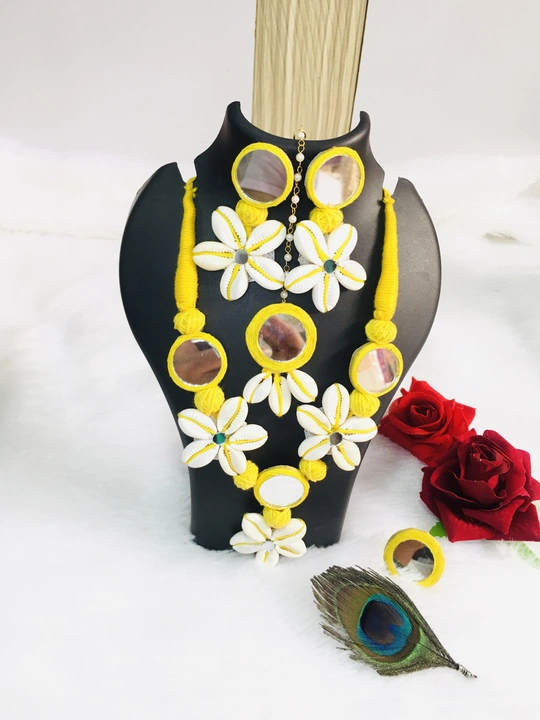 Post image This set is most trandy and best selling products, finished with Kodi and mirror . 
Complete set including necklace,statement earrings, mang tika , finger ring .